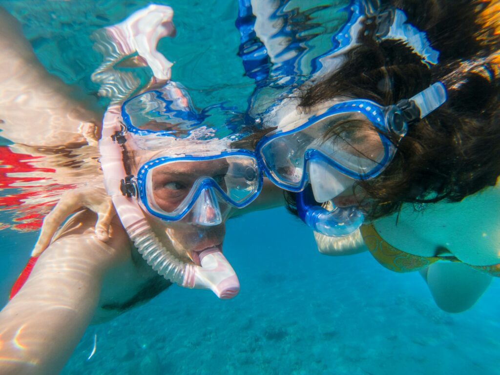 Couple snorkeling underwater in the Red sea