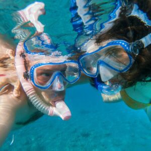 Couple snorkeling underwater in the Red sea