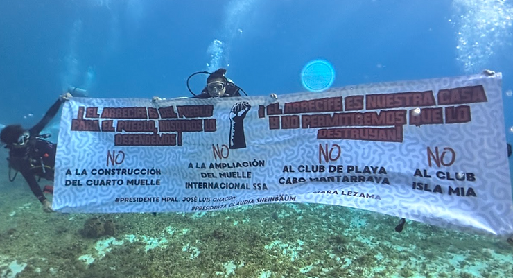 underwater protest on Villa Blanca reef
