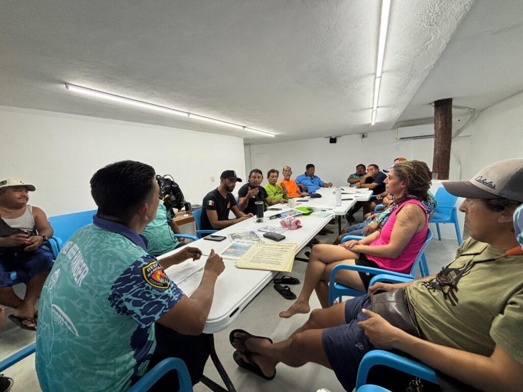 staff in green fins training at sand dollar sports